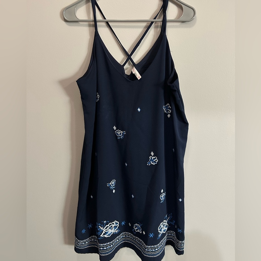 Navy tank swing dress with blue floral design. Size L